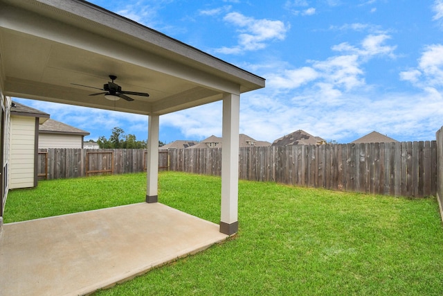 view of yard featuring ceiling fan and a patio area