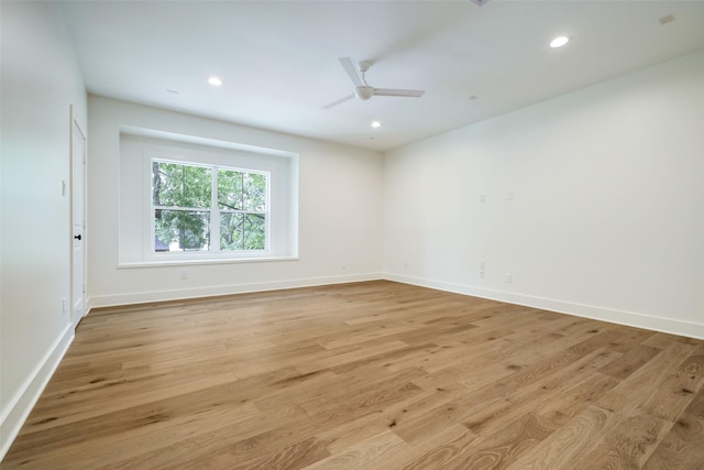 spare room featuring ceiling fan and light hardwood / wood-style floors