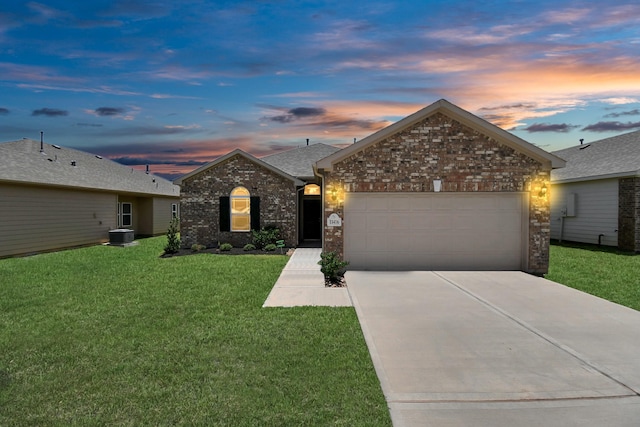 single story home with a yard, a garage, and cooling unit