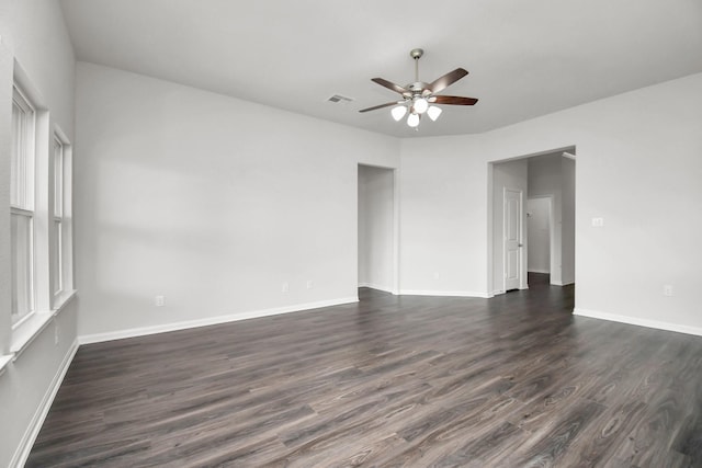 unfurnished room featuring dark hardwood / wood-style floors and ceiling fan