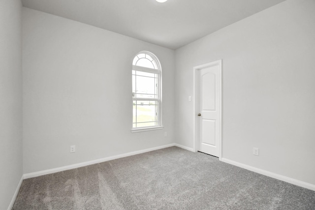 empty room with carpet flooring