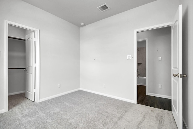 unfurnished bedroom with light carpet