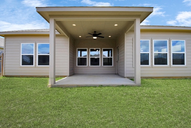 back of house featuring a lawn, a patio area, and ceiling fan