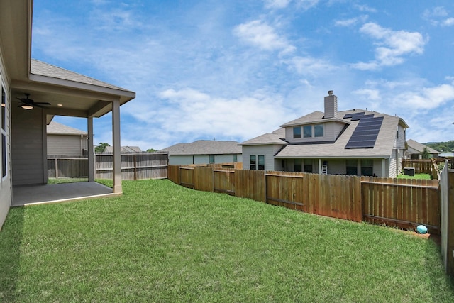 view of yard featuring a patio and ceiling fan