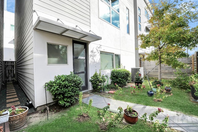 entrance to property featuring central AC unit