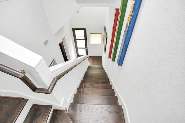 stairs with wood-type flooring