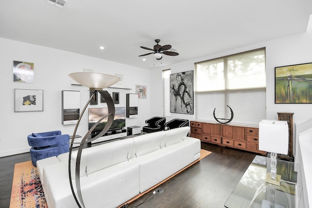 living room featuring dark hardwood / wood-style floors and ceiling fan