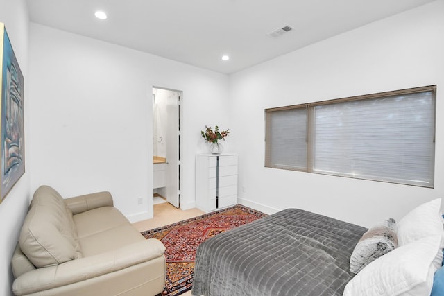 bedroom featuring ensuite bathroom