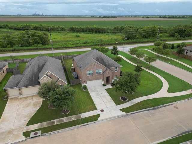 birds eye view of property with a rural view