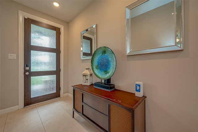 doorway to outside featuring light tile patterned floors