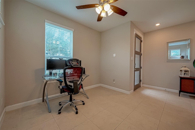 tiled office space featuring ceiling fan