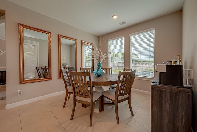 dining room with light tile patterned flooring