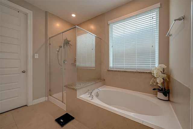 bathroom with plus walk in shower and tile patterned floors