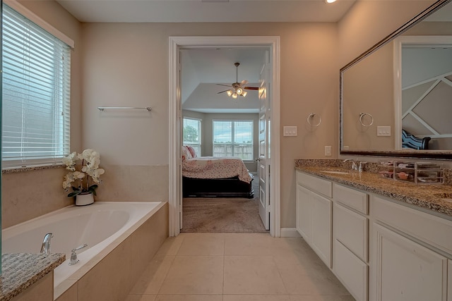 bathroom featuring tile patterned floors, ceiling fan, a healthy amount of sunlight, and vanity