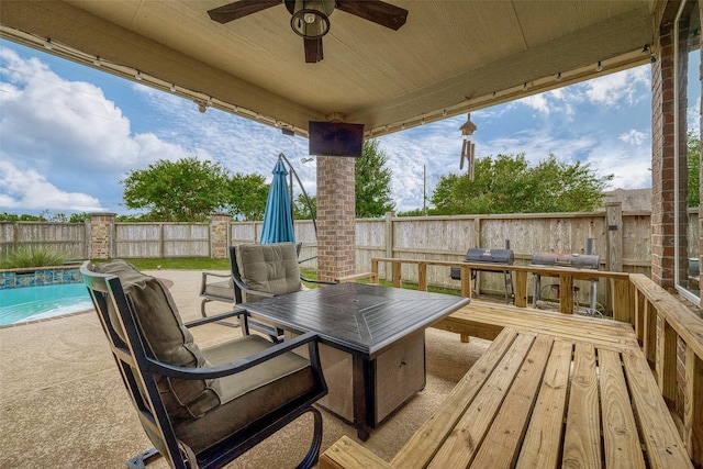 view of patio / terrace featuring a swimming pool side deck and ceiling fan