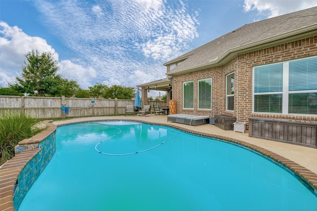 view of swimming pool featuring a patio