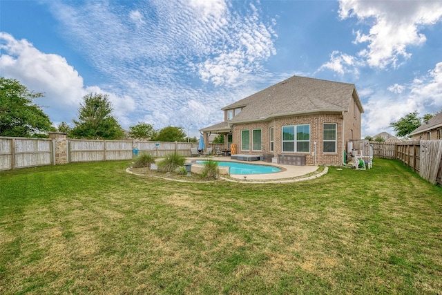 exterior space with a fenced in pool and a patio