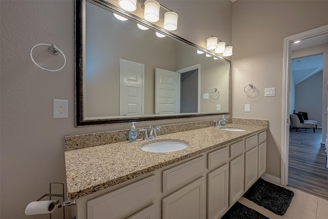 bathroom featuring hardwood / wood-style floors and vanity