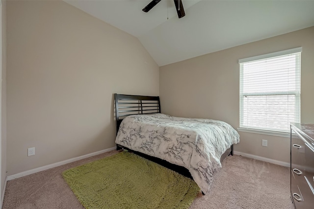 carpeted bedroom with vaulted ceiling and ceiling fan