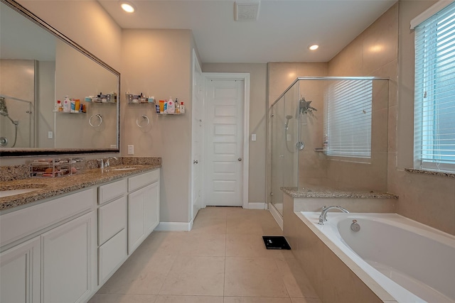 bathroom featuring tile patterned floors, vanity, and independent shower and bath