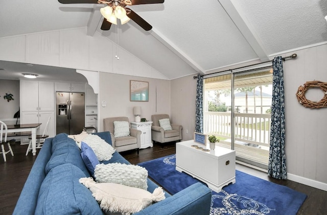 living room with dark hardwood / wood-style flooring, lofted ceiling with beams, and ceiling fan