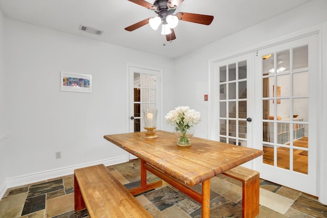 dining area with ceiling fan and french doors