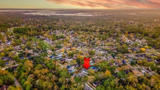 aerial view at dusk with a water view