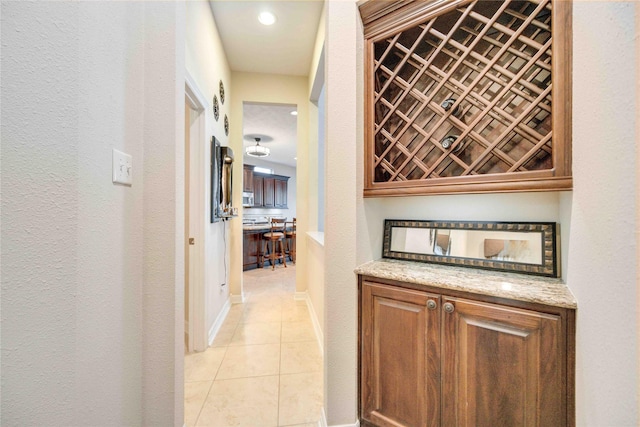 hallway with light tile patterned floors