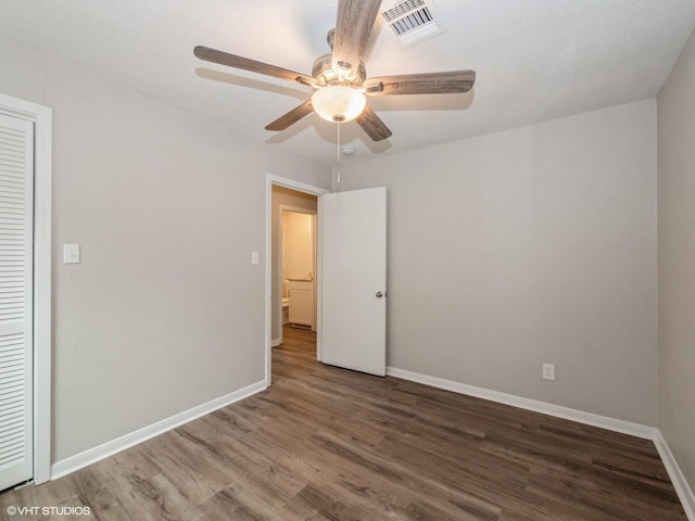 unfurnished bedroom with a closet, ceiling fan, and hardwood / wood-style floors