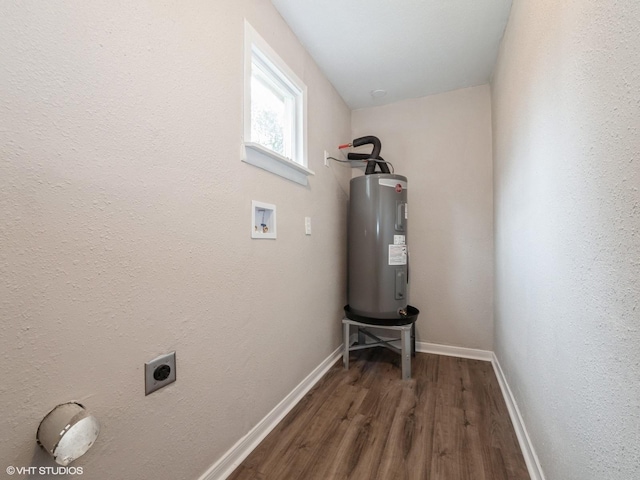 utility room featuring water heater