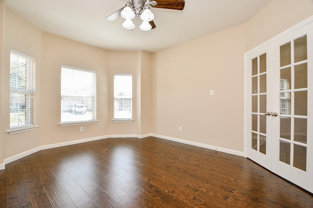 unfurnished room with french doors, dark hardwood / wood-style flooring, and ceiling fan