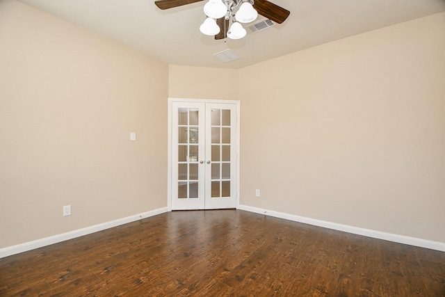 spare room with french doors, dark hardwood / wood-style floors, and ceiling fan