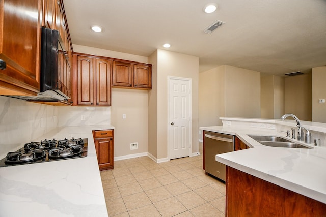 kitchen featuring dishwasher, sink, decorative backsplash, gas stovetop, and light tile patterned floors