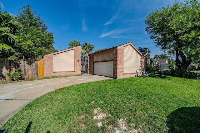 view of front of house featuring a front yard, a garage, and an outdoor structure