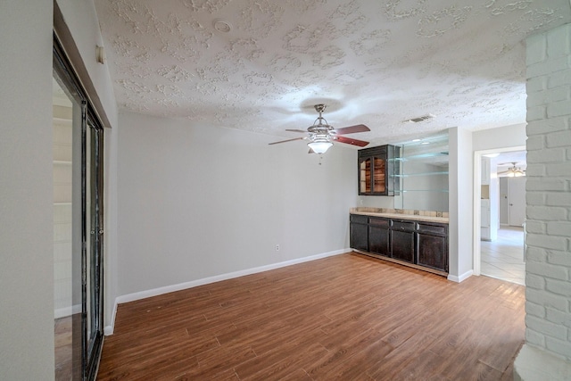 interior space featuring hardwood / wood-style floors and a textured ceiling