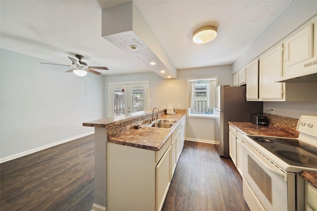 kitchen with french doors, white range with electric cooktop, sink, dark hardwood / wood-style floors, and kitchen peninsula