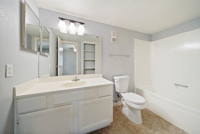 full bathroom with tile patterned flooring, shower / tub combination, vanity, and toilet