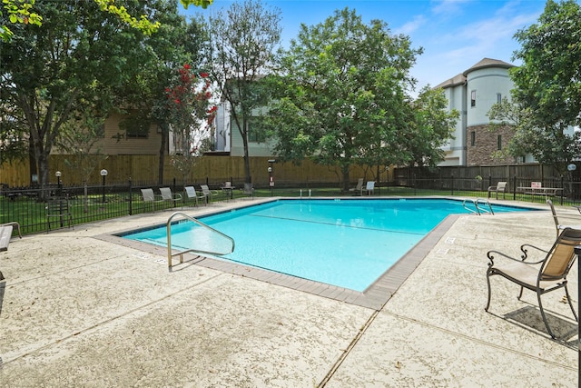 view of pool featuring a patio