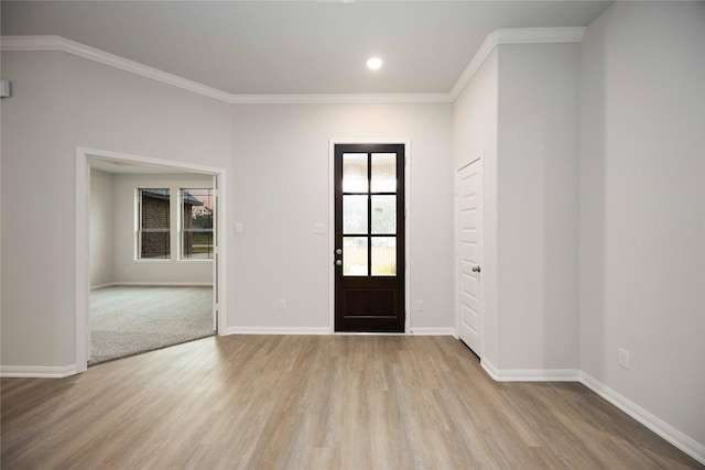 entryway featuring crown molding and light wood-type flooring