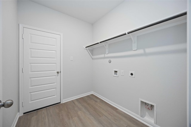 clothes washing area with washer hookup, wood-type flooring, hookup for a gas dryer, and electric dryer hookup