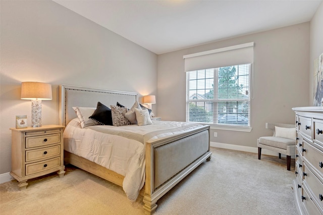 bedroom featuring light carpet