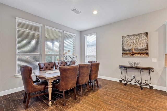 dining area with hardwood / wood-style floors