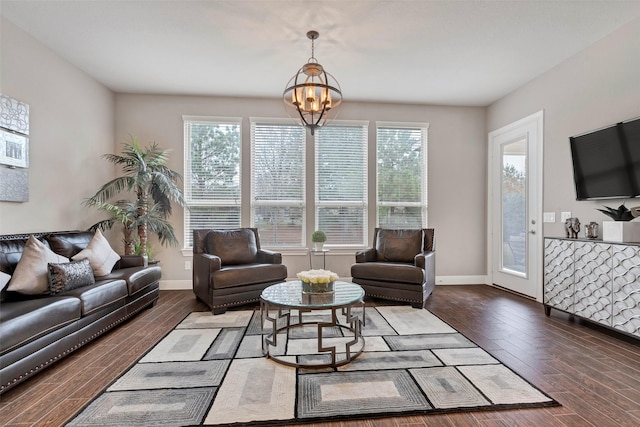 living room featuring dark hardwood / wood-style flooring and a notable chandelier