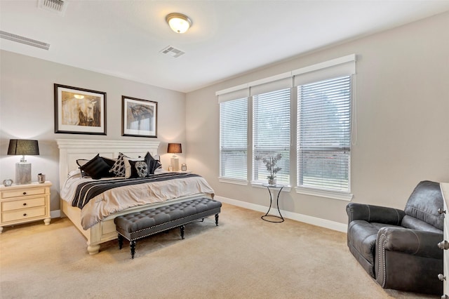 bedroom with light colored carpet