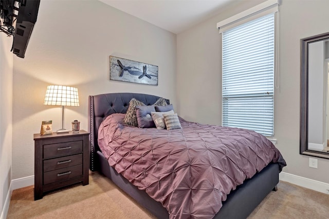 bedroom with light carpet