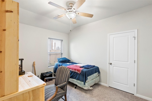 carpeted bedroom with vaulted ceiling and ceiling fan