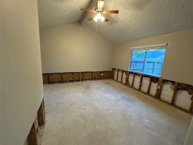 unfurnished room featuring vaulted ceiling with beams, a textured ceiling, and ceiling fan