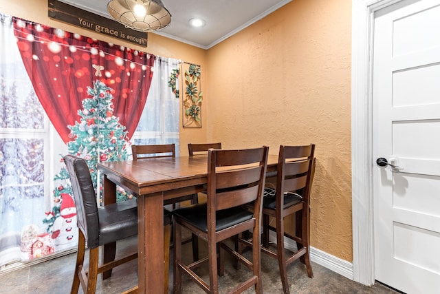 dining area featuring ornamental molding