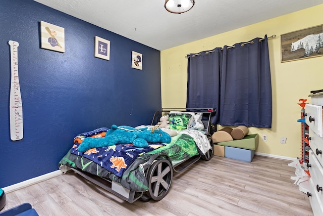 bedroom featuring light wood-type flooring