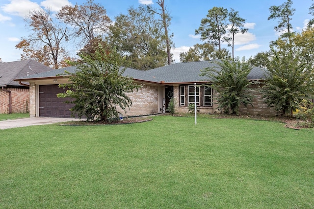 ranch-style home featuring a garage and a front lawn